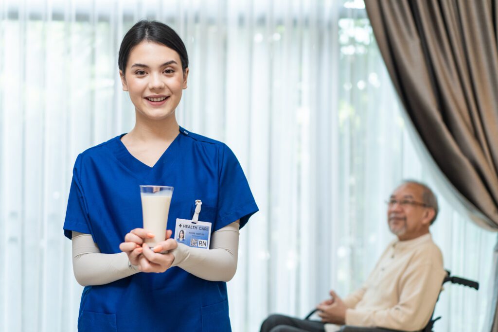 asian-beautiful-therapist-doctor-serve-milk-to-old-2023-11-27-05-13-01-utc