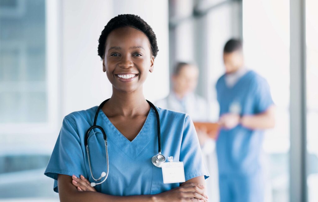 smile-nurse-and-portrait-of-black-woman-with-arms-2023-11-27-04-49-07-utc (1)